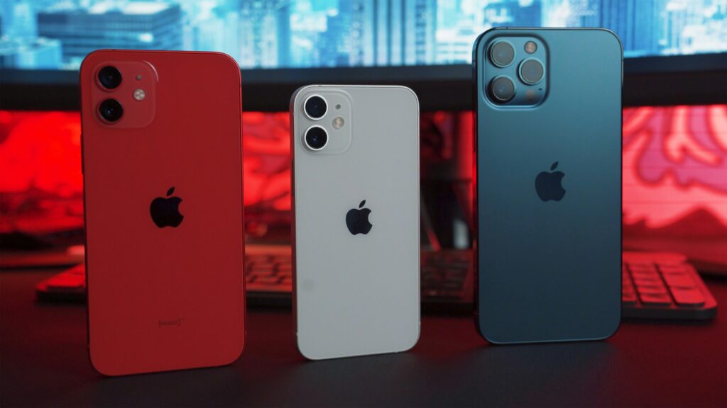 Three iPhones lined up in a row together.