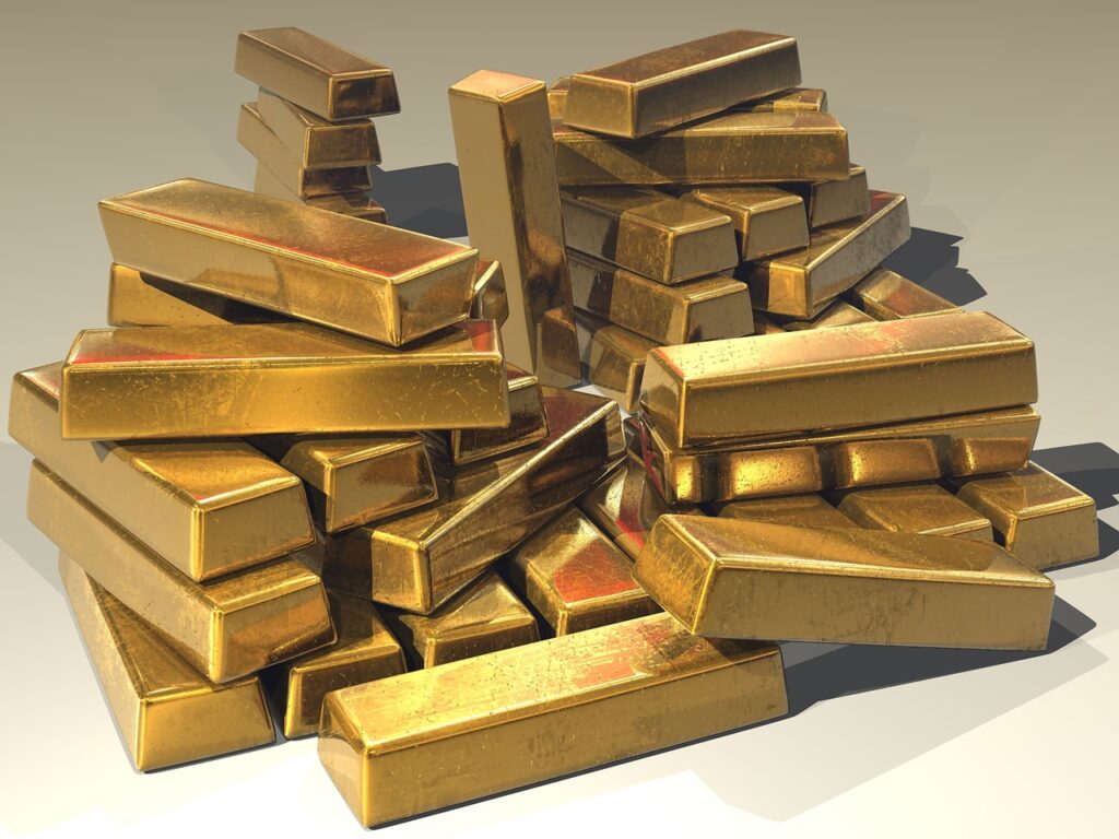 A pile of gold bars on a white background